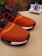 en blanco y negro de Adidas NMD Los Ángeles las zapatillas de deporte de color naranja